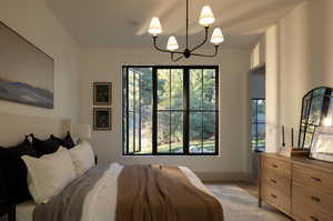 Bedroom featuring a notable chandelier