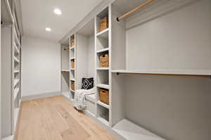 Walk in closet featuring light wood-type flooring