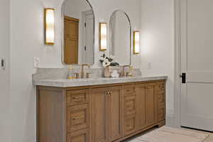 Bathroom with hardwood / wood-style floors and vanity