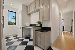 Kitchen featuring gray cabinets and light hardwood / wood-style floors