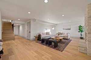 Living room with light hardwood / wood-style flooring