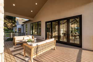 Deck featuring outdoor lounge area and french doors