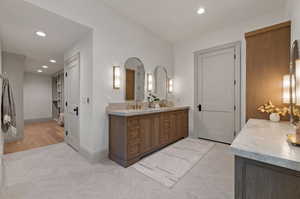 Bathroom with vanity and hardwood / wood-style floors