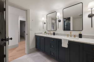 Bathroom featuring wood-type flooring and vanity