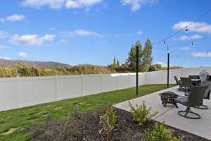 View of private yard with extended patio, fully landscaped with Jensen Nature Park Views.