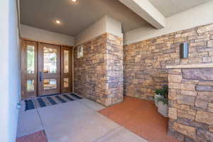 View of exterior entry featuring french doors