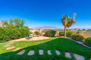 View of yard featuring a patio area and a mountain view