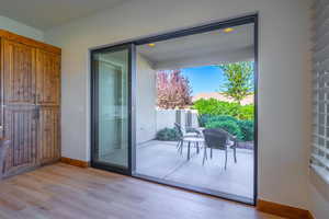 Doorway to outside with light hardwood / wood-style floors