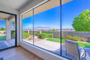 Unfurnished sunroom with a mountain view