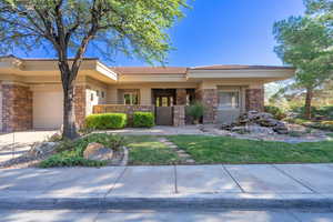 View of front of property with a front yard