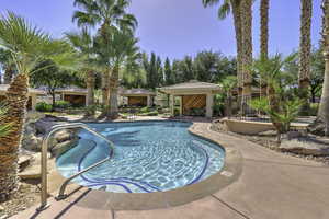 View of pool with a gazebo and a patio area