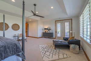 Carpeted bedroom with ceiling fan