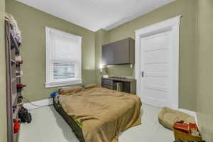 Bedroom featuring a textured ceiling