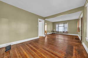 Unfurnished room featuring hardwood / wood-style flooring