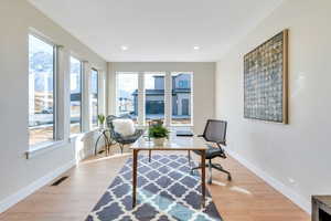 Office space featuring light wood-type flooring