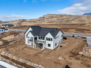 Birds eye view of property with a mountain view