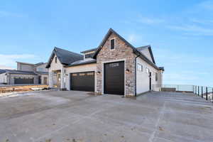 View of property exterior featuring a garage