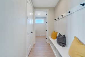 Mudroom with light wood-type flooring