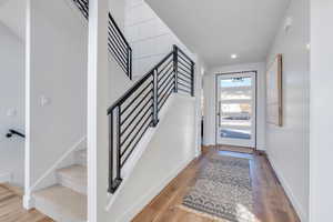 Foyer with light hardwood / wood-style floors