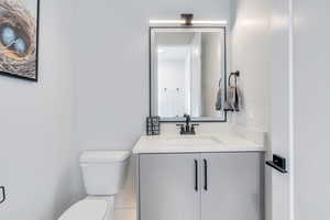 Bathroom with toilet and vanity