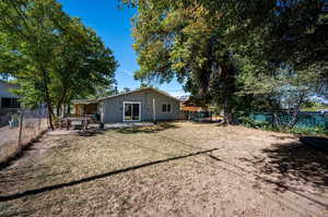 Back of house featuring a patio and a lawn