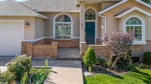 Entrance to property featuring a garage