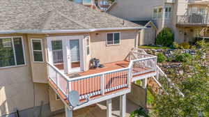 Back deck leading down to the tiered yard