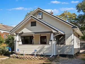 Bungalow-style home featuring a front yard