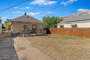 Rear view of house with a wooden deck