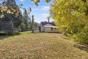 View of yard featuring a trampoline