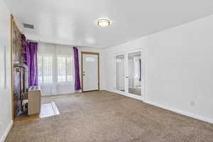 View of carpeted foyer