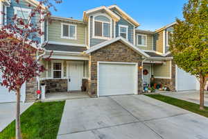 View of front of property featuring a garage