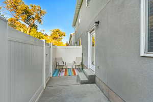 View of patio with fence