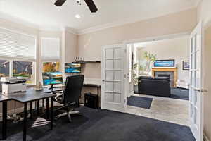 Tiled home office featuring french doors, crown molding, and ceiling fan