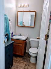 Bathroom featuring vanity and toilet