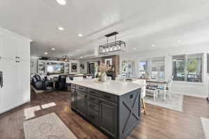 Kitchen featuring a center island, pendant lighting, a fireplace