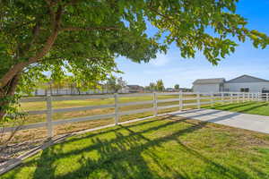 View of yard with a rural view