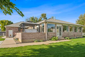 Rear view of house with a gazebo