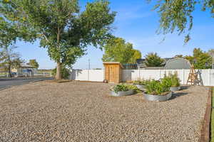 View of the yard with garden area