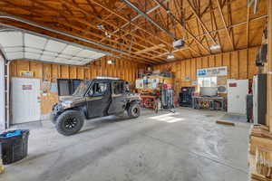 Detached Garage featuring a garage door opener