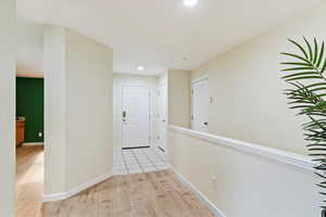 Corridor featuring light hardwood / wood-style flooring