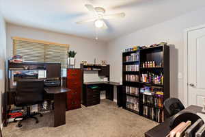 Carpeted office with ceiling fan