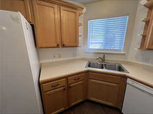 Kitchen with sink and white appliances