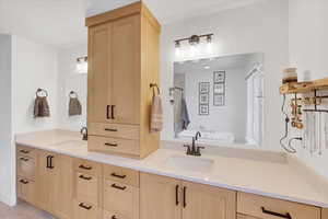 Bathroom featuring vanity and plus walk in shower