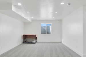 Interior space featuring light colored carpet