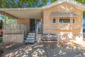 View of front of house with a patio