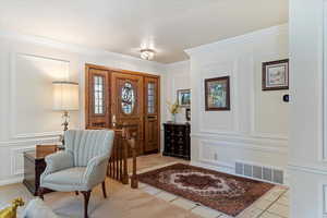 Tiled entryway with ornamental molding