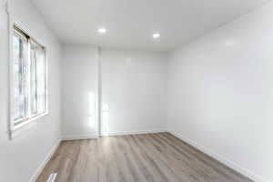 Unfurnished room featuring light hardwood / wood-style floors