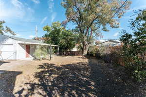 View of yard with a garage