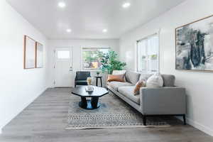 Living room with light hardwood / wood-style floors